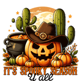 A jack-o'-lantern wearing a cowboy hat sits among pumpkins, cacti, a cauldron, and orange stars. The text reads: "IT'S SPOOKY SEASON Y'all"
