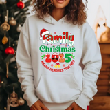 White hoodie with Family Christmas 2025 design, making memories together text, Santa hat graphic, Christmas tree background