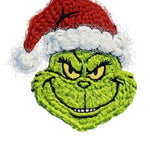 Green grumpy character in red santa hat, hand-embroidered stylized design