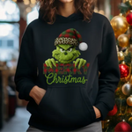 Black hoodie with Grinch-themed Christmas design featuring green character wearing leopard santa hat