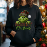 Black hoodie with Grinch-themed Christmas design featuring green character wearing leopard santa hat