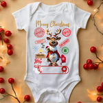 White baby onesie with Christmas reindeer design, red berries, holiday lights, Merry Christmas text and postal stamps