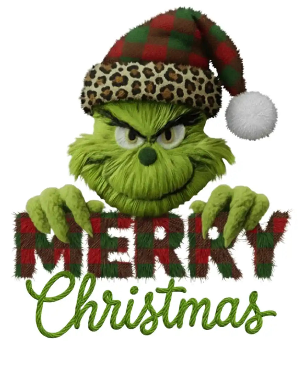 Green Grinch character in leopard-print Santa hat holding 'Merry Christmas' plaid text