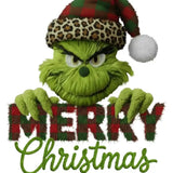 Green Grinch character in leopard-print Santa hat holding 'Merry Christmas' plaid text