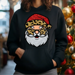 Black hoodie with glittery red leopard print Santa Claus design, Christmas tree ornaments in background