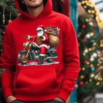 Red hoodie with Santa Claus riding motorcycle, carrying gifts, Christmas tree and lights in background