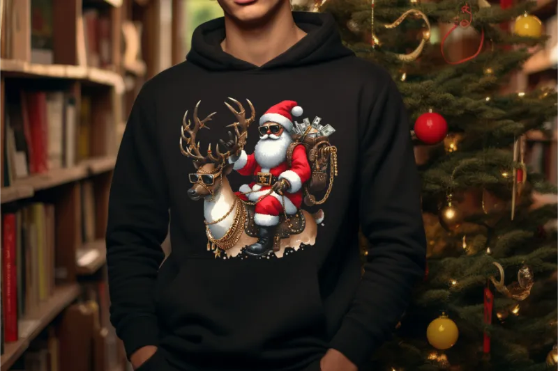 Black hoodie with festive Santa and reindeer DTF print, Christmas tree in background