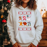 White hoodie with Christmas-themed graphic featuring dancing Santa, reindeer, snowman, and penguin characters
