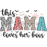 The text "This MAMA loves her boos" is stylized with Halloween-themed letters featuring skulls, spiderwebs, pumpkins, and bats in black, pink, tan, and blue colors.