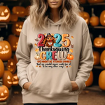 Beige hoodie with 2025 Thanksgiving Crew design, surrounded by carved jack-o-lantern pumpkins