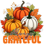 A cluster of pumpkins in orange, red, and white hues, surrounded by autumn leaves. Text reads: "Always GRATEFUL" in large orange letters.