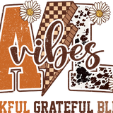 Fall-themed graphic design with leopard print, checkered, and plaid letters spelling "FALL" with "Vibes" written in script, surrounded by white daisies. Text below reads: "THANKFUL GRATEFUL BLESSED"