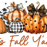 Five decorative pumpkins in orange, black, and white, with plaid and polka dot patterns, adorned with bows and autumn maple leaves. Text reads: "It's Fall Y'all"