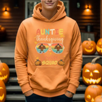 Orange hoodie with Auntie Thanksgiving Squad design featuring turkey sunglasses, surrounded by carved pumpkins