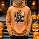 Orange hoodie with 2025 Thanksgiving Crew design, surrounded by carved jack-o-lantern pumpkins