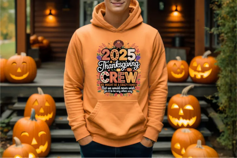 Orange hoodie with 2025 Thanksgiving Crew design, surrounded by carved jack-o-lantern pumpkins