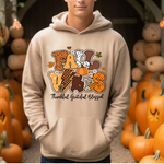 Cream hoodie with colorful fall-themed Fall Vibes design surrounded by orange pumpkins