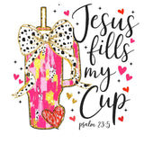 Pink and gold tumbler with dalmatian print bow, hearts, and scripture-inspired text 'Jesus fills my cup'